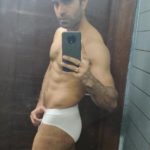 Muscular Indian hunk shows fit body in white briefs
