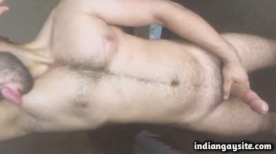 Hairy muscle boy wanks and licks sexy body