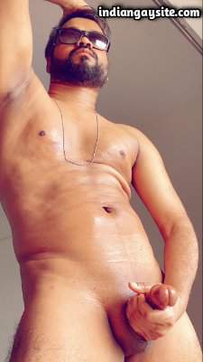 Naked horny model posing with a perfect boner