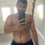 Stripping gay bear teasing hot body and cock