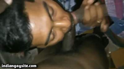 Gay threesome pics of a slutty sucker on two dicks