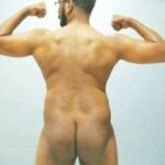 Flexing naked hunk sporting boner in sexy nude pics