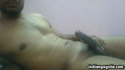 Stripping sexy guy pulling his long hard cock out in pics