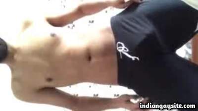 Young gay stripper showing off his big bulge