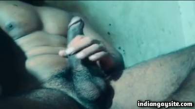 Muscular hot man playing with his big hard boner
