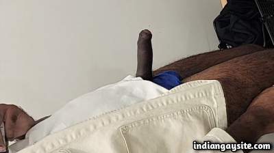 Horny hairy man teasing big hard cock in trial room