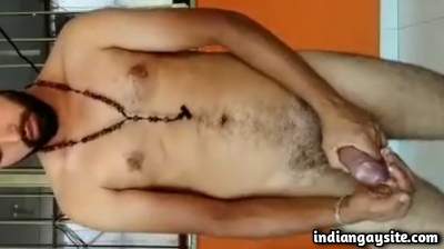 Young naked man jerking hard and licking his own cumshot