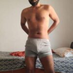 Fit nude hunk teasing his hot body in bulging undies