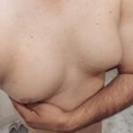 Smooth man boobs of a sexy and horny curvy gay boy