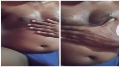 Fat guy squeezing his man boobs