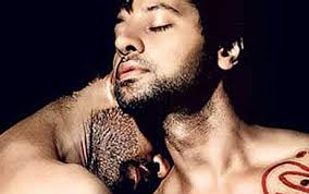 Naked hunk kissing his lover's neck