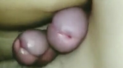 Young adult boys cumming under the blankets at night