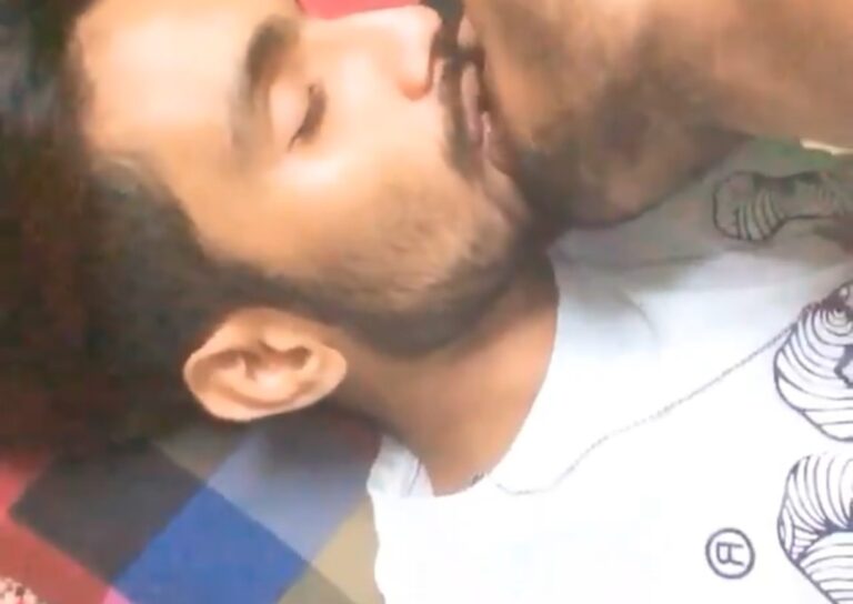 Gay men kiss romantically and make out